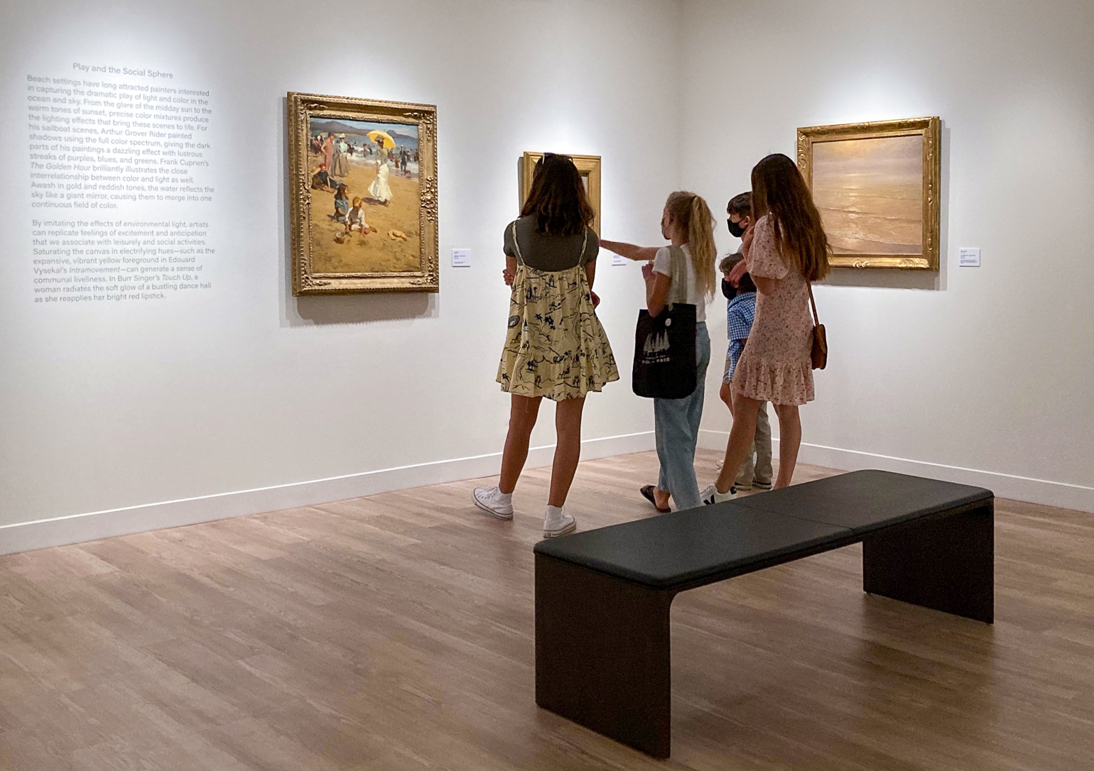 Visit Young visitors at the museum looking at a painting