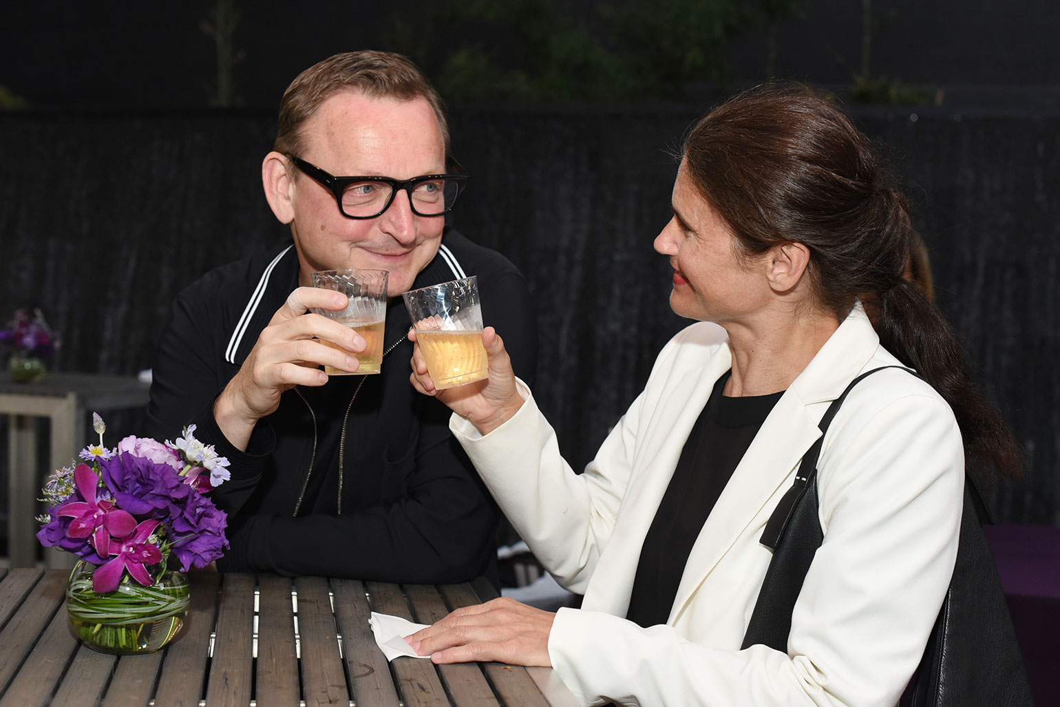 Two members of Friends of IMCA toast