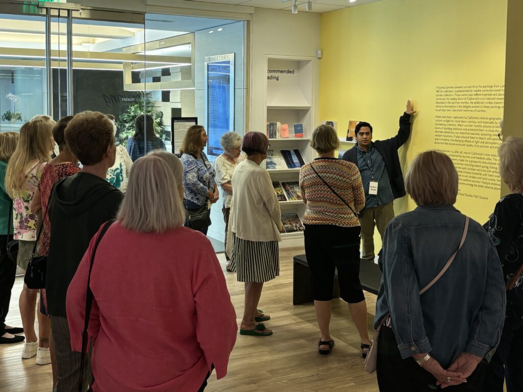 A Langson IMCA staff member introduces the exhibition to a Group Visit.