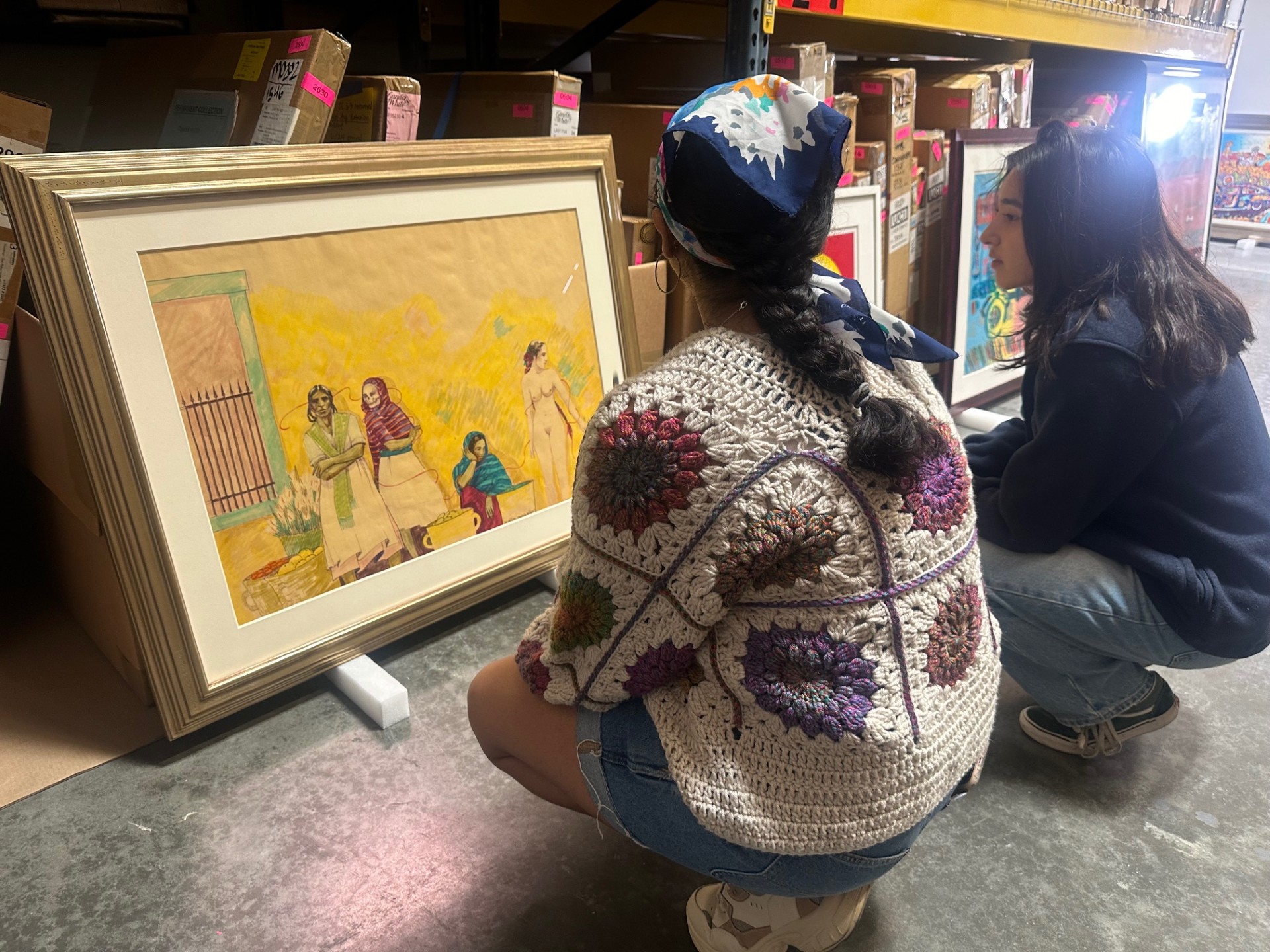 Lourdes Enriquez and Jewel Loya get a closer look at works for their In Focus Gallery Presentation